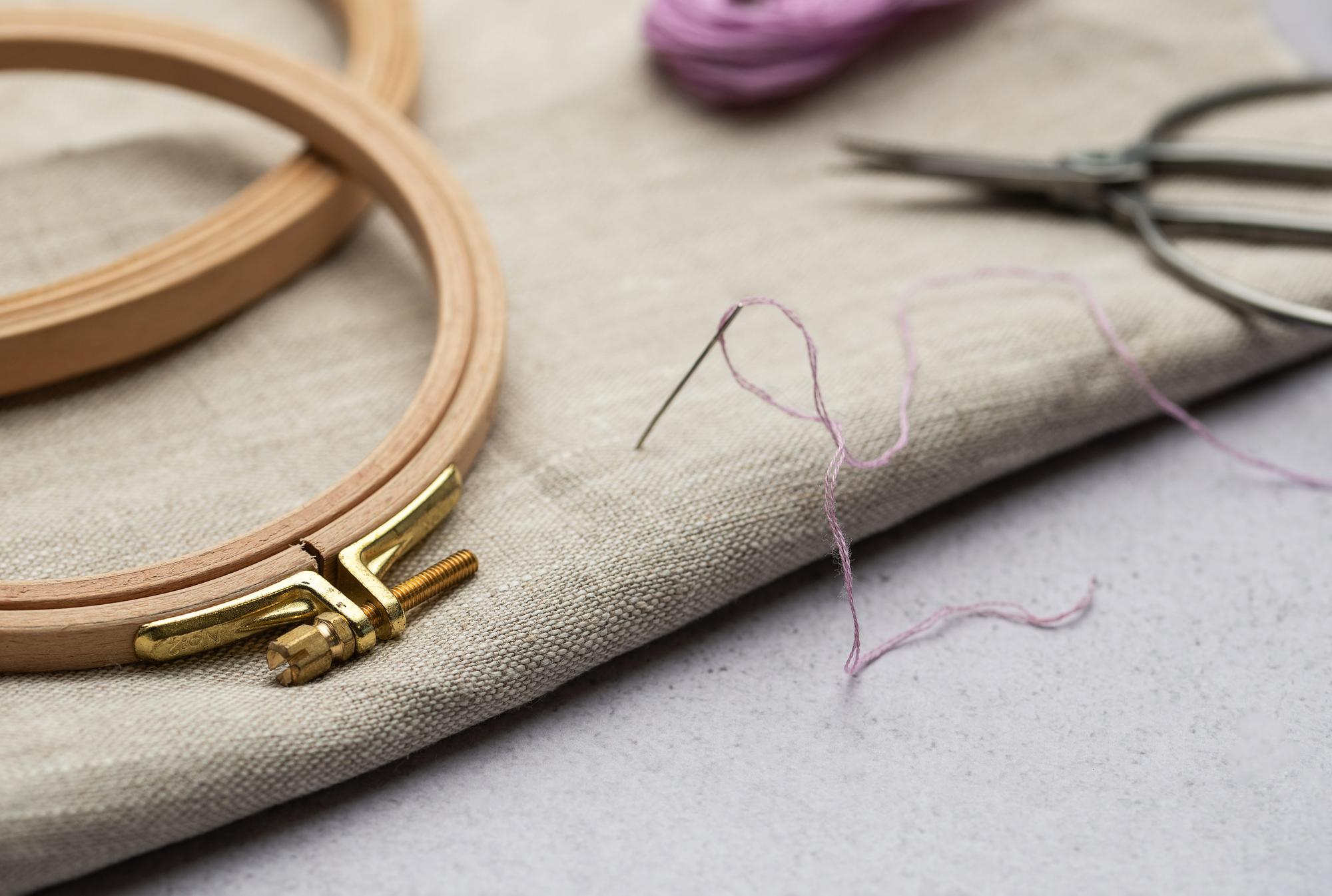 Close-up of hand embroidery on linen